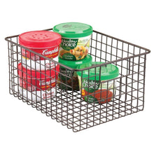 Load image into Gallery viewer, Discover the mdesign farmhouse decor metal wire food storage organizer bin basket with handles for kitchen cabinets pantry bathroom laundry room closets garage 12 x 9 x 6 4 pack bronze